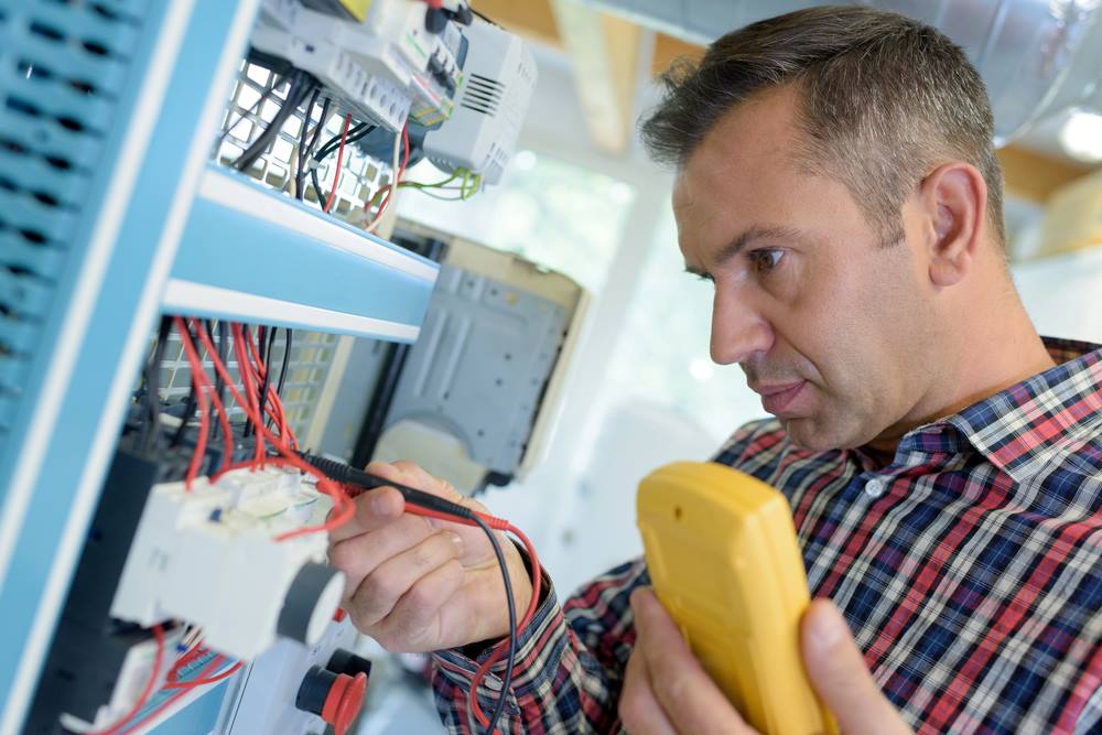 Image of a worker calibrating a printer, featuring Hero Service Pros and highlighting their commitment to real partnership with no fluff.