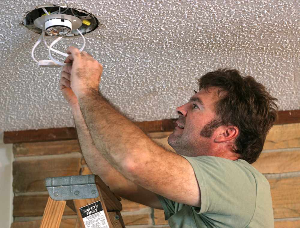 Image of lighting installation in progress, featuring Hero Service Pros and highlighting why electricians trust HERO SERVICE PROS for reliable and professional electrical solutions.
